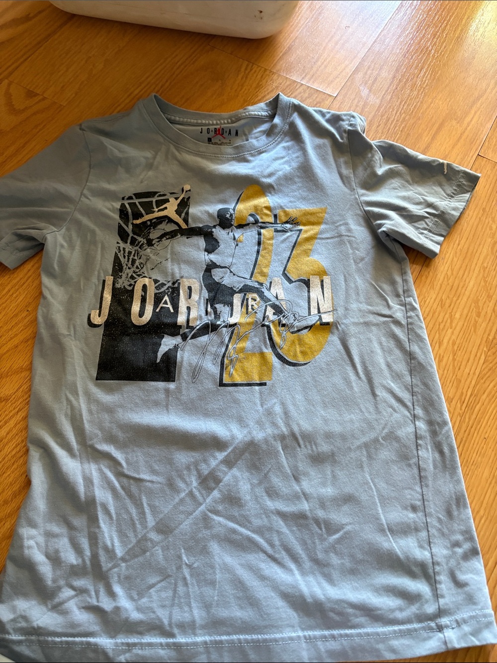 Jordan Light Blue Tee with Black & Gold Graphic